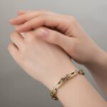 Dubbelzijdige bicolor gouden scharnierarmband