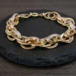 Gouden tricolor schakelarmband