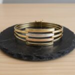 Gouden tricolor slavenarmband