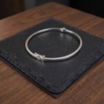 Christian wit gouden slavenarmband