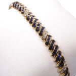 14 karaat gouden armband diamant en saffier