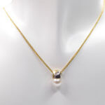 Gouden ketting met parel en diamant hanger