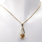 Gouden ketting met tijgeroog hanger