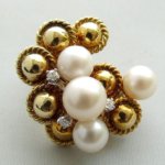 Gouden broche en oorclip set
