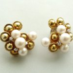 Gouden broche en oorclip set