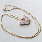 Gouden collier met vlinder hanger