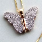 Gouden collier met vlinder hanger