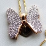 Gouden collier met vlinder hanger