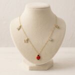 Gouden bedelketting met lieveheersbeestje