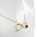 Gouden zirkonia Infinity lieveheersbeestje hanger