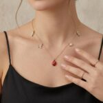 Gouden bedelketting met lieveheersbeestje