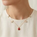 Gouden bedelketting met lieveheersbeestje