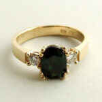 Christian gouden ring met groene saffier