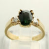 Christian gouden ring met groene saffier