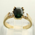 Christian gouden ring met groene saffier