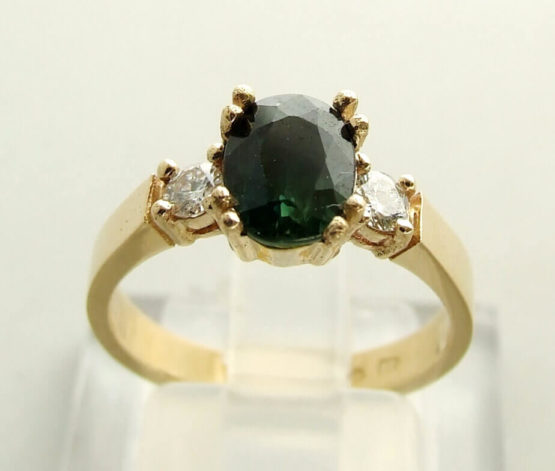 Christian gouden ring met groene saffier