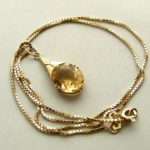 Gouden collier en hanger met citrien