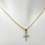 Gouden miniatuur kruis