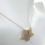 Gouden ster hanger met uitschuifbare hart