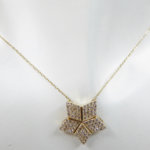 Gouden ster hanger met uitschuifbare hart