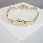 Christian gouden slavenarmband golvend model