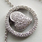 Gouden collier met diamanten harten hanger