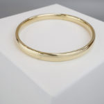 Goud op zilver slavenarmband