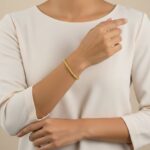 Gouden getordeerde armband