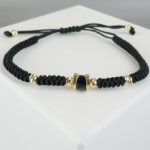 Christian armband met goud en onyx