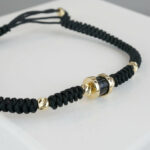 Christian armband met goud en onyx