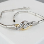 Christian bicolor goud armband met zirkonia