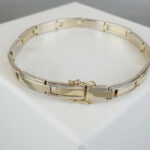 Christian goud bicolor armband