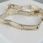 Christian goud bicolor armband