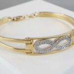 Christian 18 karaat bicolor gouden slavenarmband