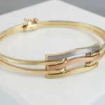 Christian gouden tricolor slavenarmband