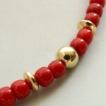 Bloedkoraal collier met gouden accenten