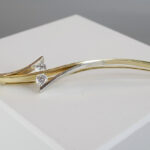 Bicolor gouden broche met diamanten