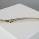 Bicolor gouden broche met diamant