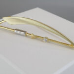 Bicolor gouden broche met zirkonia