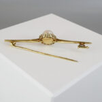 Gouden broche met bolsjewieken
