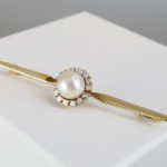 Gouden broche met bolsjewieken