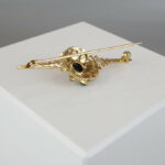 Gouden broche met granaten