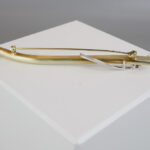 Gouden broche met zirkonia