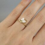 Geel gouden ring met dubbele parel