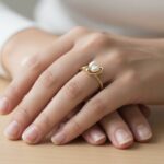 Geel gouden ring met dubbele parel