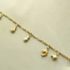Gouden armband met bedels