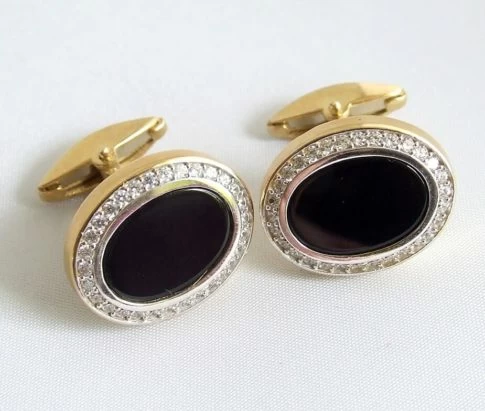 Gouden manchetknopen met onyx en diamanten