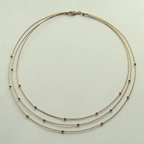Gouden choker met balletjes