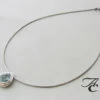 Gouden collier en hanger met aquamarijn
