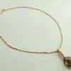 Gouden collier met rookkwarts en diamant